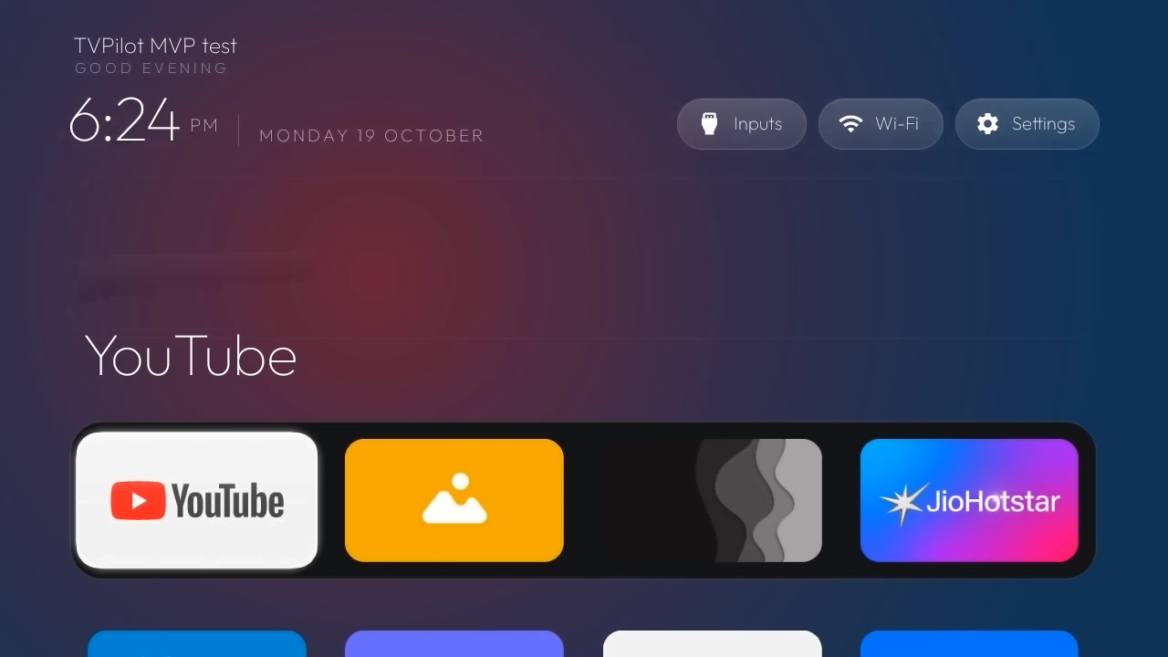 TVPilot Home on a TV, showing four selected dock apps from an earlier development build